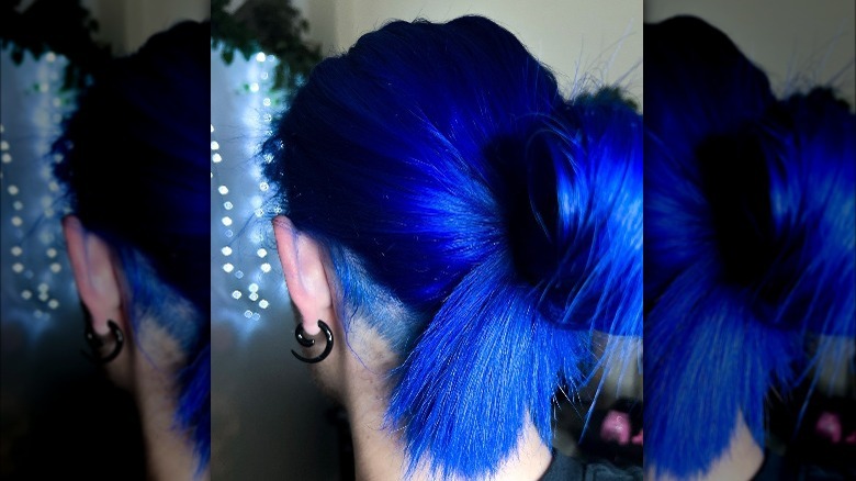Electric blue hair in a bun