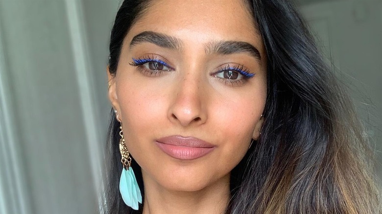 Woman wearing blue eyeliner