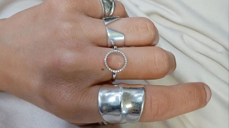 Hand with silver rings