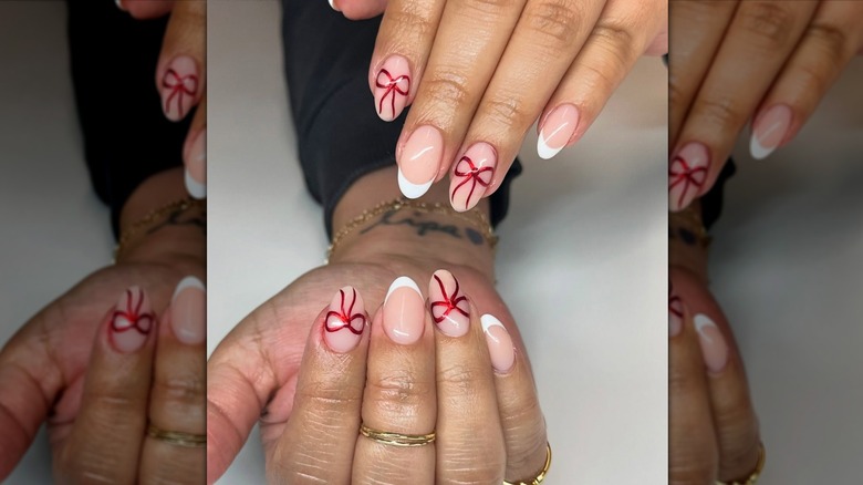 manicure with red chrome bows