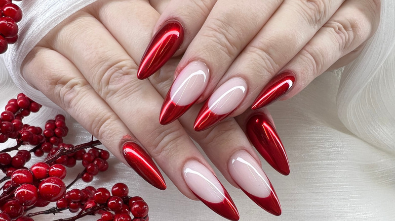 chrome red manicure with berries in the photo