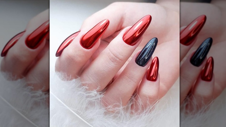 red chrome mani with black accent nail