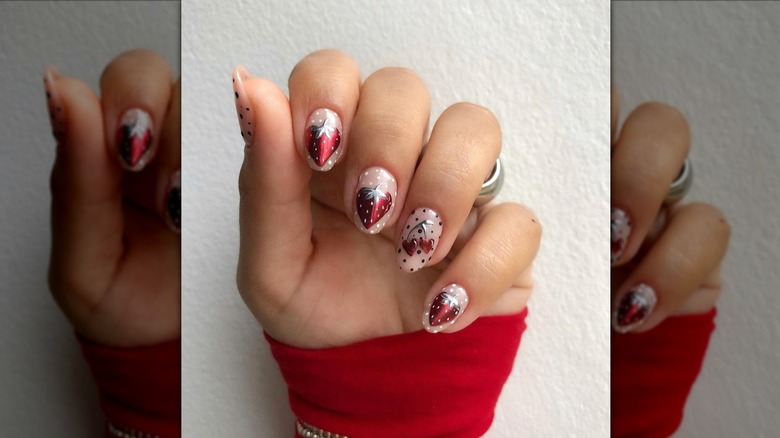 strawberries and heart red chrome manicure