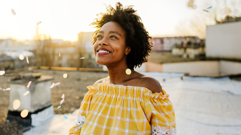 Person smiling on roof