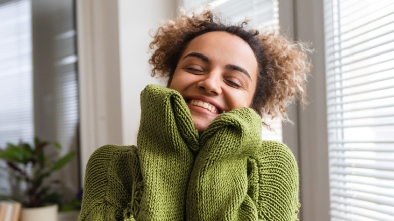 Woman smiling in sweater