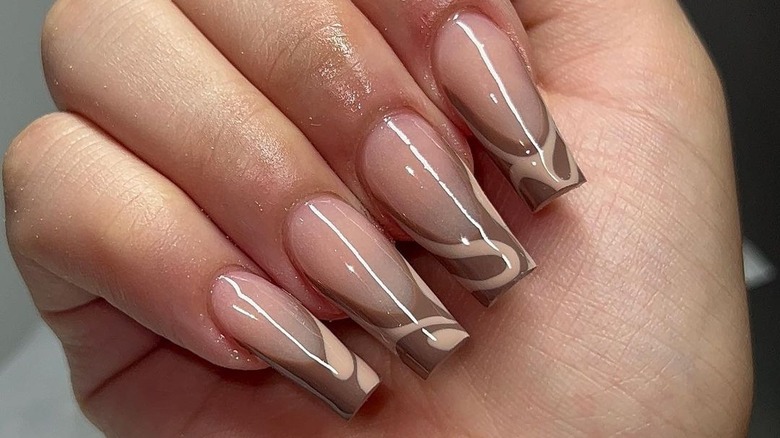 brown-tip manicure with light brown accents