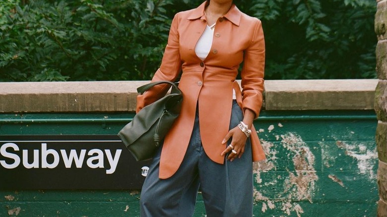 woman wearing a leather peplum jacket 