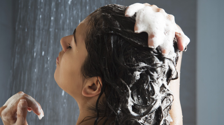 Back view of a woman washing her hair