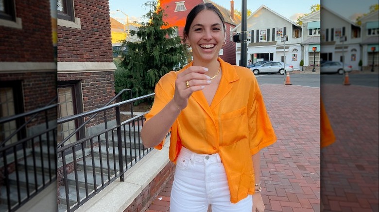 Woman smiling in orange cabana shirt