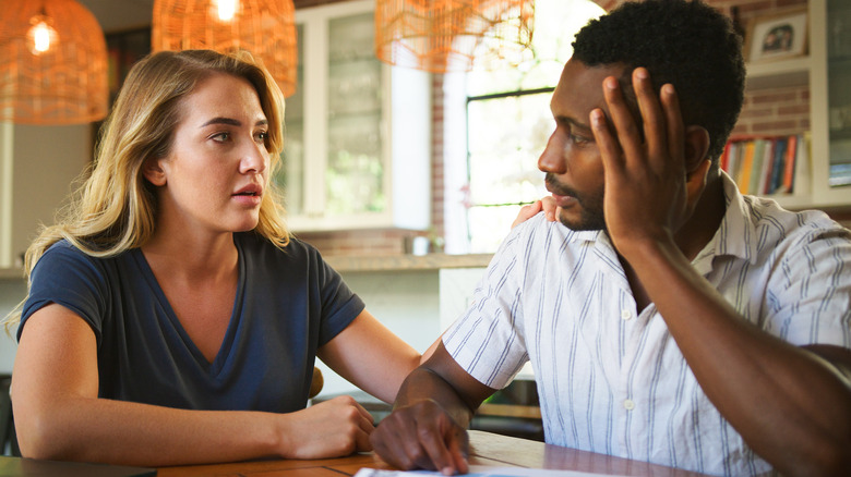 Heterosexual couple having a difficult conversation