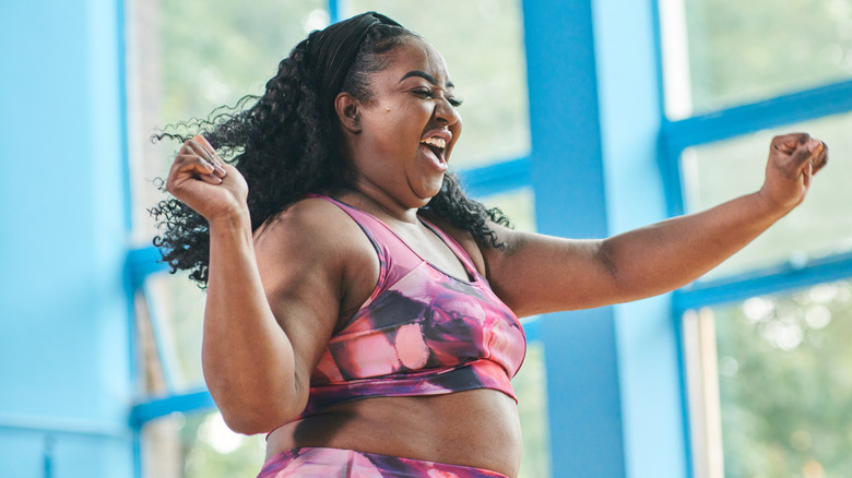 Woman in a workout set dancing