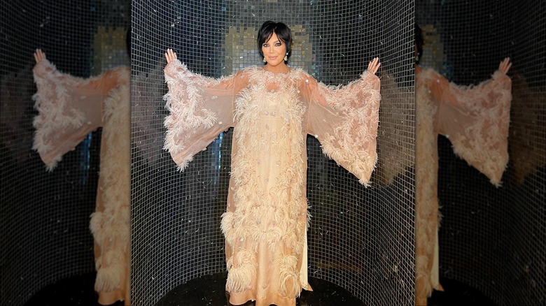 Kris Jenner in a feathered dress