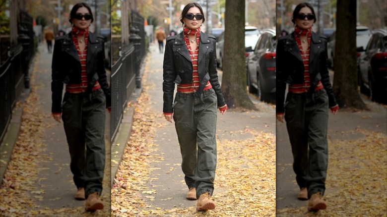 Emily Ratajkowski wearing a cropped leather jacket while walking in New York City