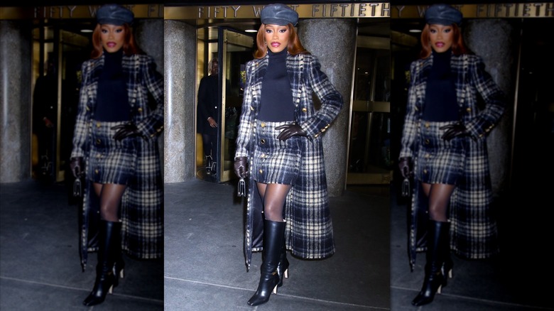 Keke Palmer wearing a plaid trench coat and skirt in New York City