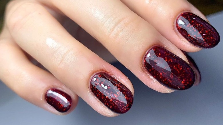 Dark red glitter nails
