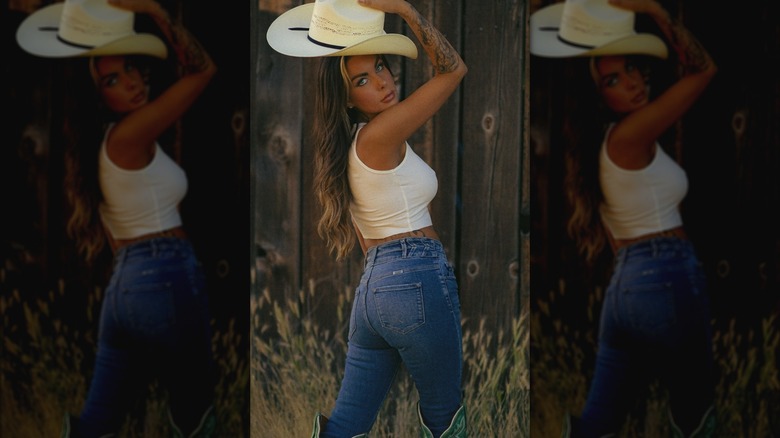 Woman in jeans and a white tank 