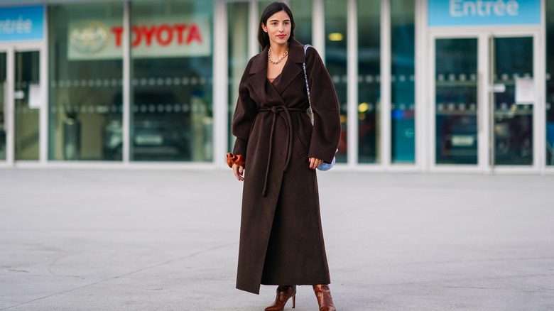Woman in a brown coat 