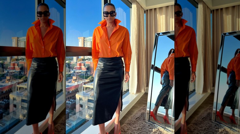 Orange shirt and leather skirt