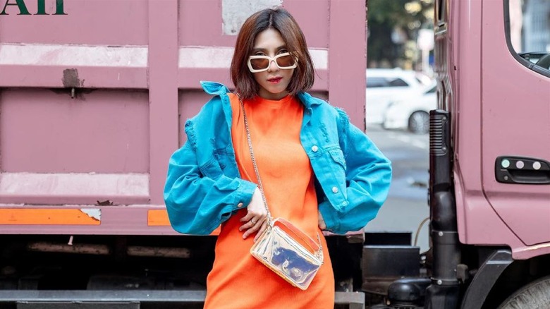 Woman wearing orange and blue