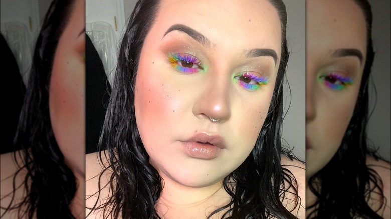 Woman with rainbow lashes