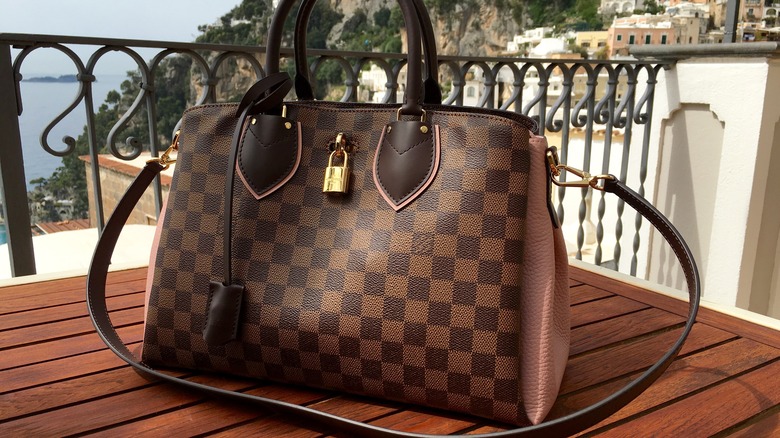 Louis Vuitton Designer bag on table