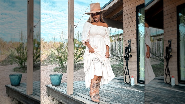 Woman in a dress and cowboy boots
