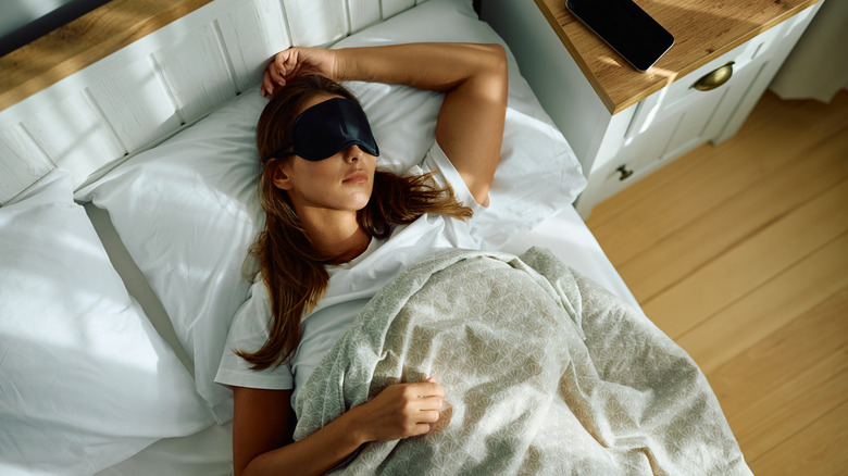 Woman sleeping with sleep mask