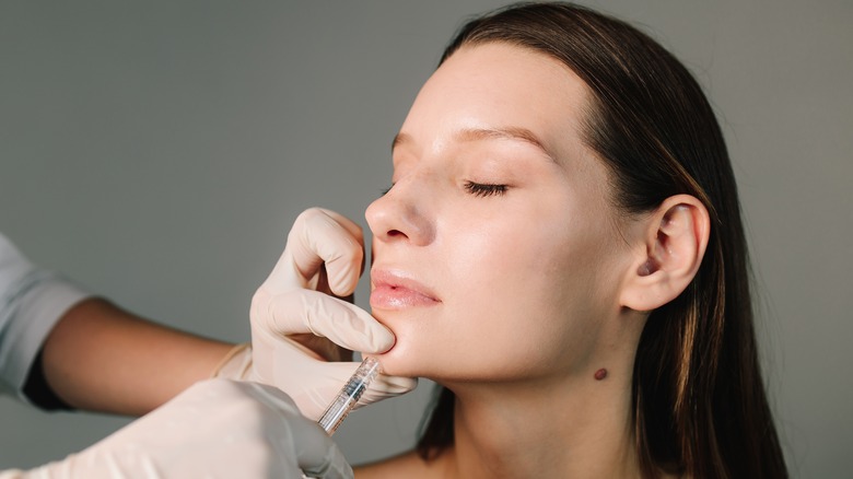 Woman getting filler in her chin