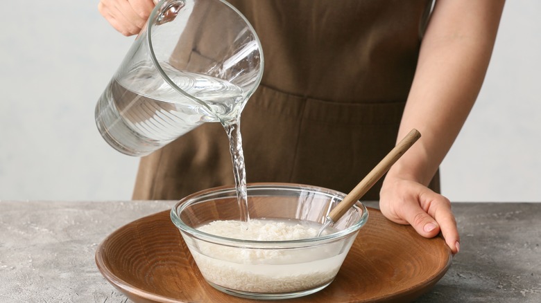 Person making rice water