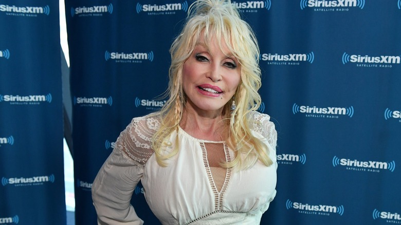 Dolly Parton smiling and looking demure for SiriusXM