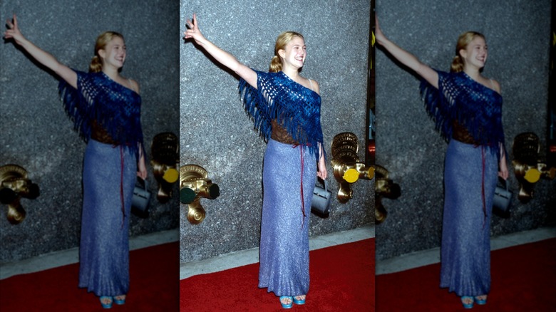 Drew Barrymore on the red carpet in a blue floor-length skirt and blue knit poncho top