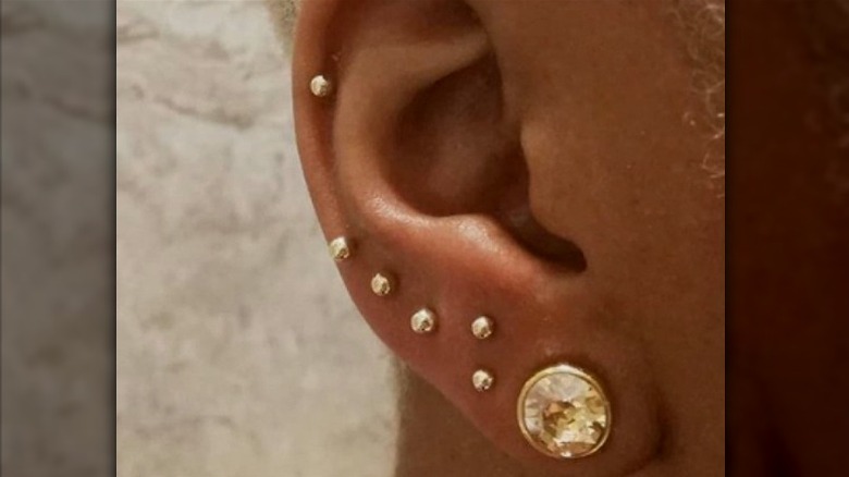 Ear with gold studs