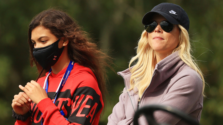 Elin Nordegren and daughter Sam Woods are pictured together cheering on Charlie Woods