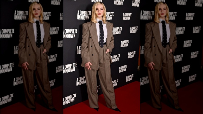 Elle Fanning dressed in a suit and tie at UK premiere of "A Complete Unknown"