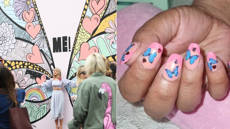 Taylor Swift standing by a butterfly mural and butterfly and heart nails