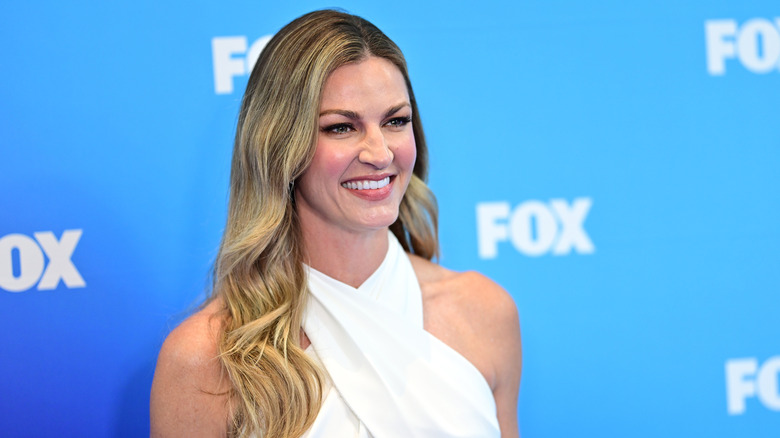 Erin Andrews smiling while looking off-camera