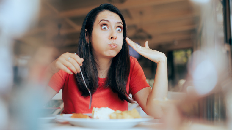 woman eating spicy food