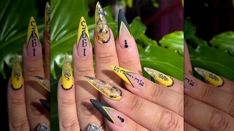 Black and yellow Aries manicure
