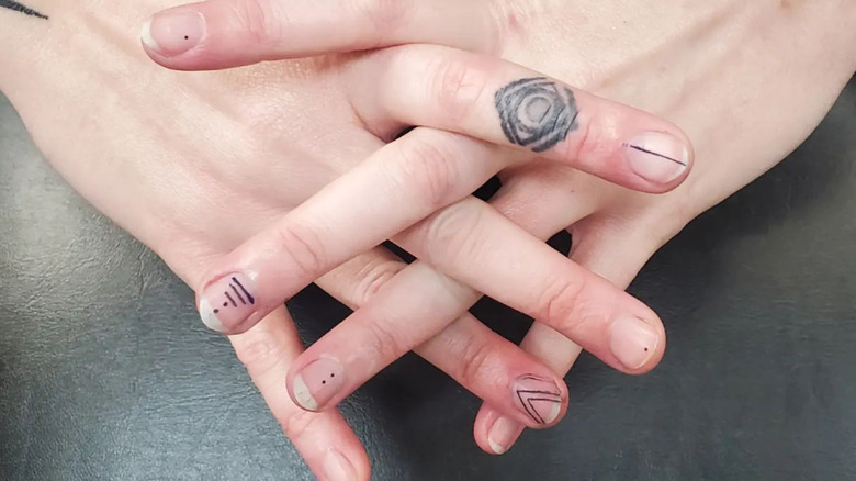 Minimalistic geometric line fingernail tattoos