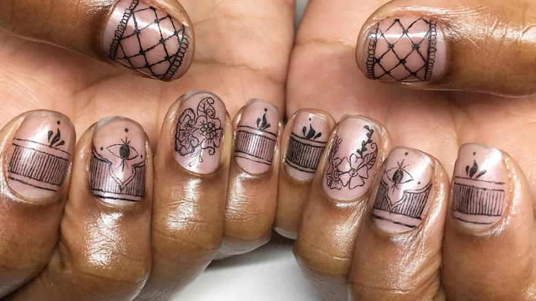 Mehndi inspired fingernail tattoo artwork