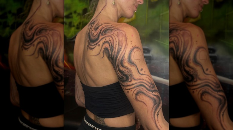 Back and arm tattoo
