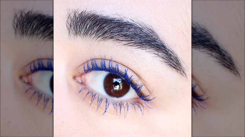Person wearing blue mascara