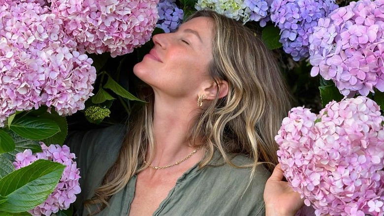 Gisele Bundchen posing with flowers