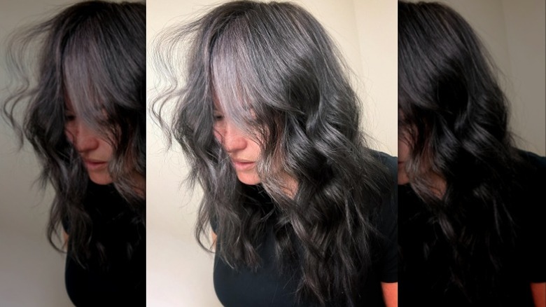 A woman with gray blended hair 