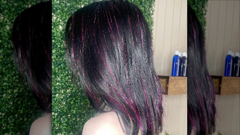 Person with pink hair tinsel