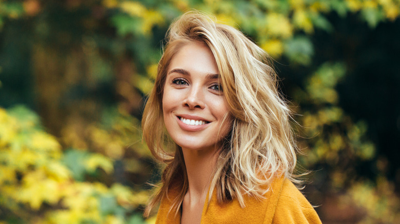 Woman wearing orange jacket