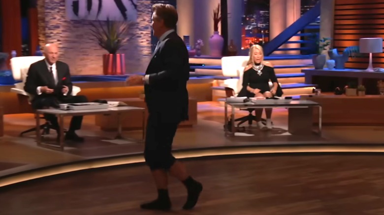 Robert Herjavec walks around the studio in Apolla Socks