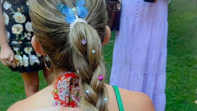 Girl with pearls and crystals in her braid