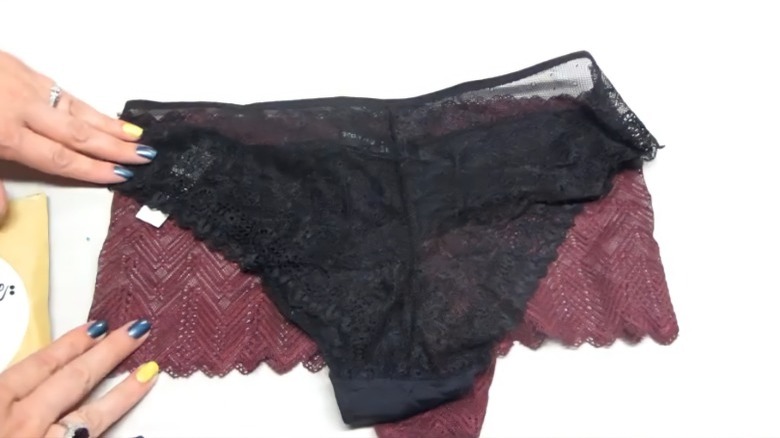 BootayBag Reviewer on YouTube unboxing an order of black and burgundy underwear