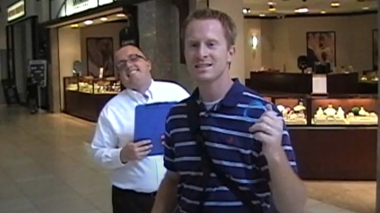 Robert Naylor holding an Esso watch